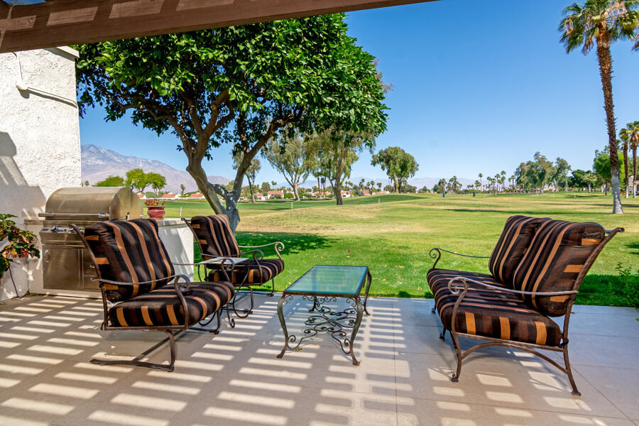 723 Inverness Drive Rancho Mirage, CA 92270 - Photo 28 of 49 an outdoor sitting area with furniture and garden
