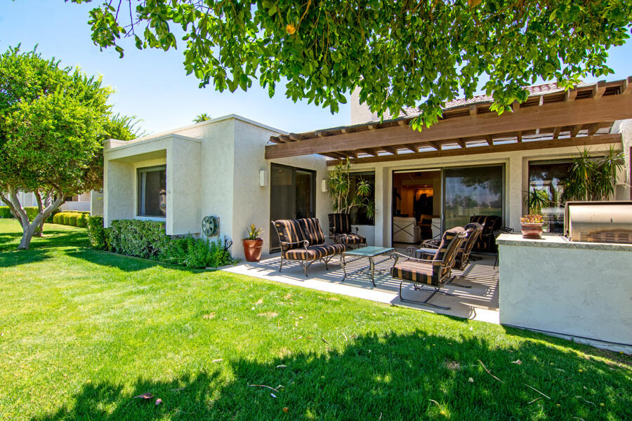 723 Inverness Drive Rancho Mirage, CA 92270 - Photo 29 of 49 a view of a backyard with a patio and plants