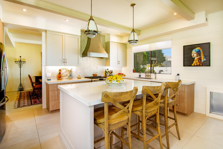 723 Inverness Drive Rancho Mirage, CA 92270 - Photo 4 of 49 a dining table chairs and a white refrigerator