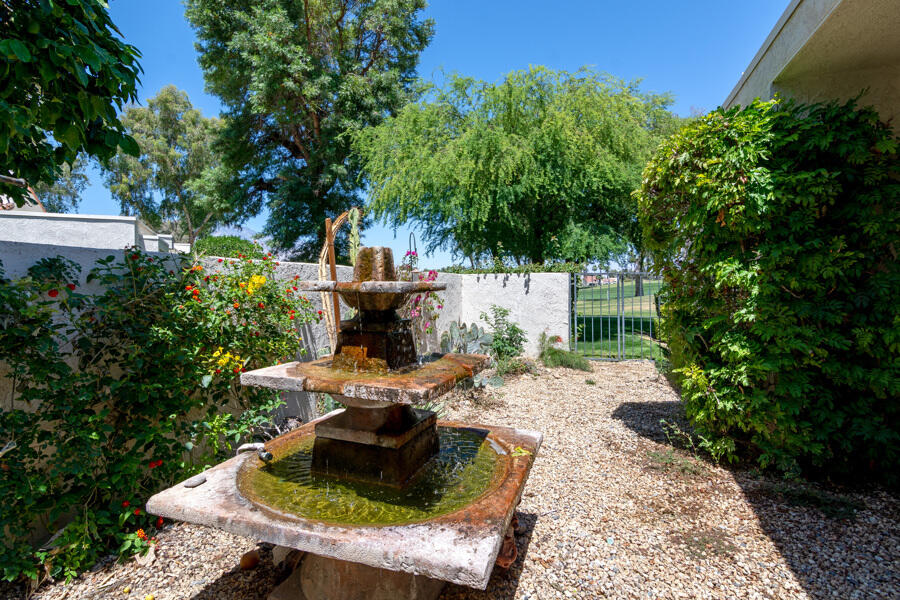 723 Inverness Drive Rancho Mirage, CA 92270 - Photo 31 of 49 a view of a house with backyard sitting area and garden