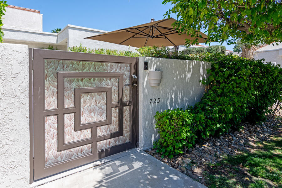 723 Inverness Drive Rancho Mirage, CA 92270 - Photo 32 of 49 a front view of a house with a garden