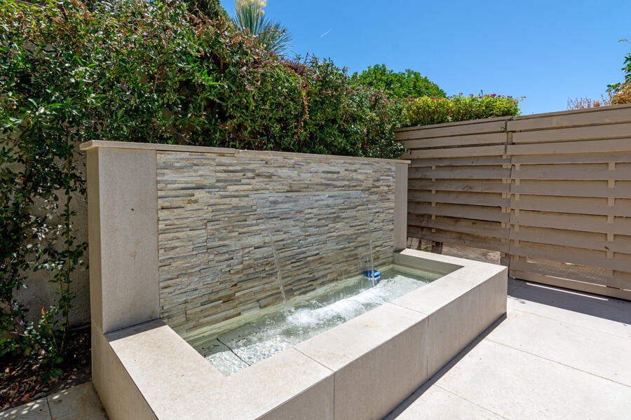 723 Inverness Drive Rancho Mirage, CA 92270 - Photo 35 of 49 a view of a wooden bench and potted plants