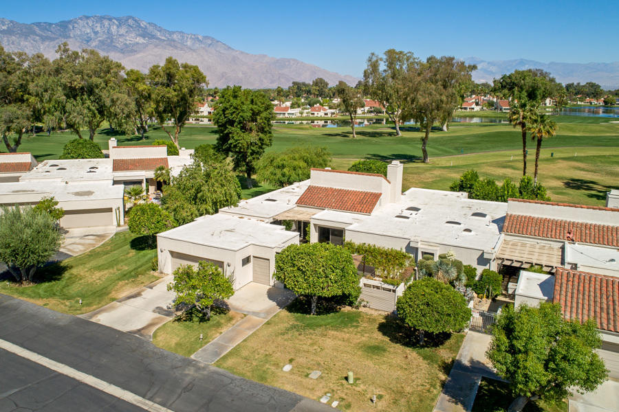 723 Inverness Drive Rancho Mirage, CA 92270 - Photo 39 of 49 an aerial view of a house with a garden and lake view