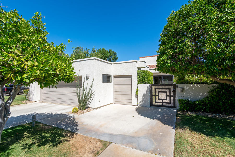 723 Inverness Drive Rancho Mirage, CA 92270 - Photo 43 of 49 a white house that has tree in front of it