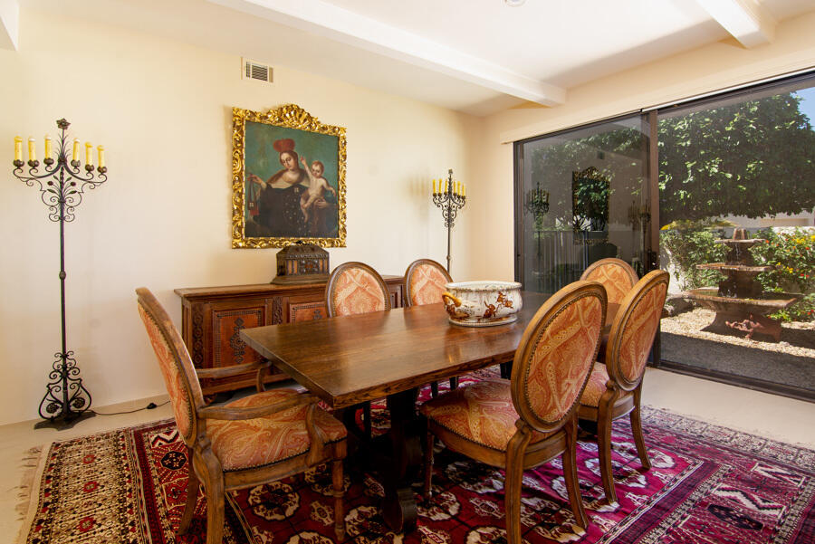 723 Inverness Drive Rancho Mirage, CA 92270 - Photo 9 of 49 a view of a dining room with furniture and wooden floor