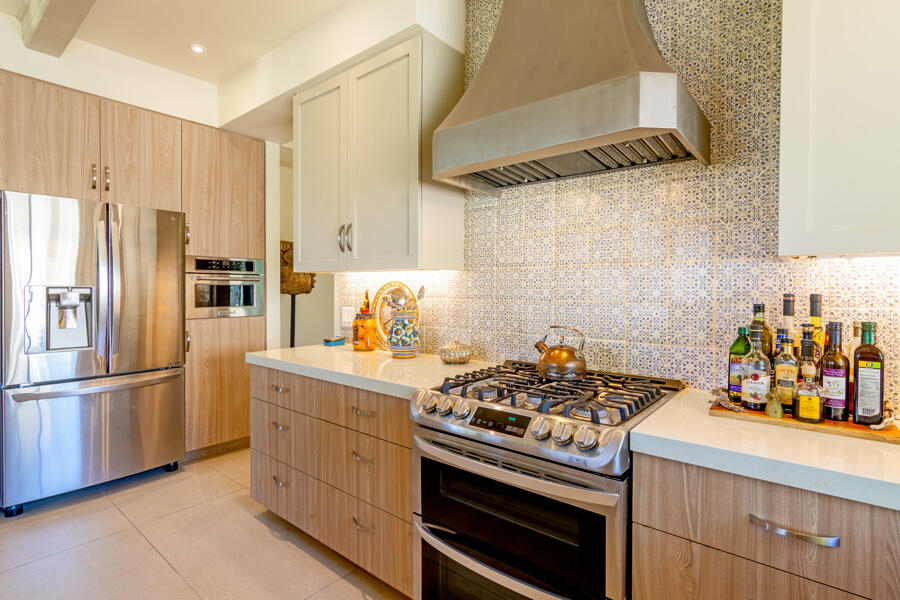 723 Inverness Drive Rancho Mirage, CA 92270 - Photo 10 of 49 a kitchen with a stove and a refrigerator