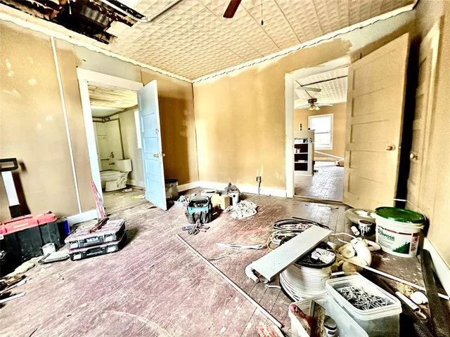 a bedroom with a bed and a mirror