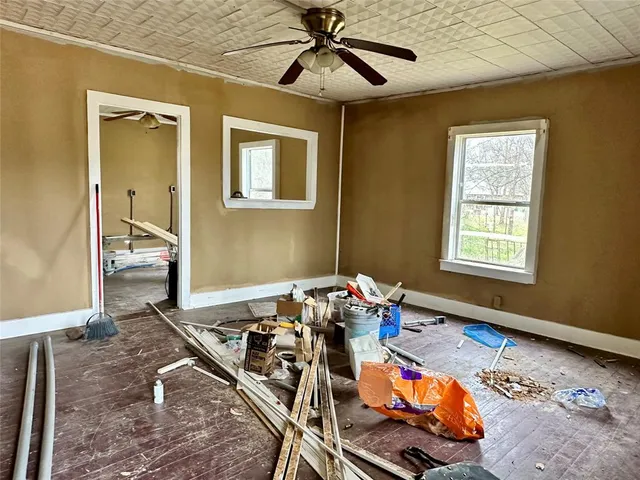 a bedroom with furniture and a window
