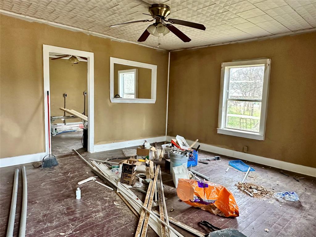 6049 Farm Road 3236 Dike, TX 75437 - Photo 9 of 12 a bedroom with furniture and a window
