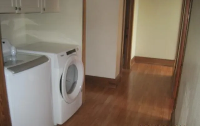 a utility room with washing machine
