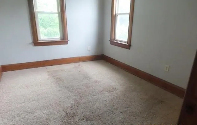 an empty room with windows