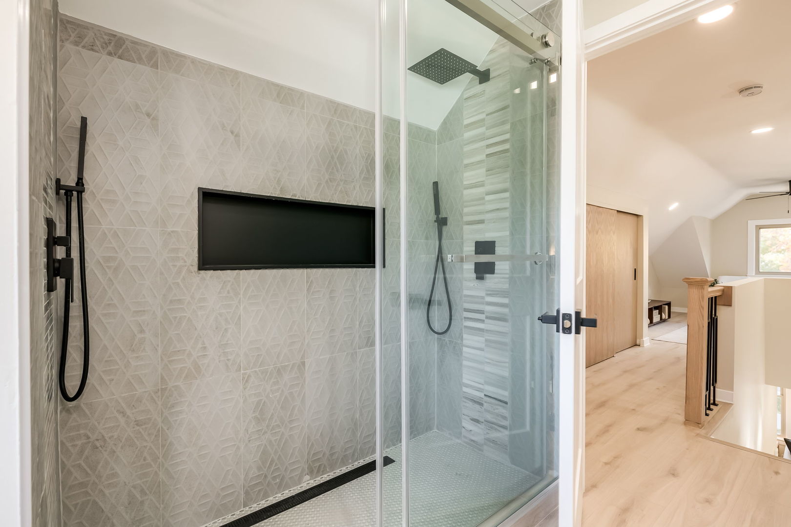 5144 North Kolmar Avenue Chicago, IL 60630 - Photo 13 of 27 a bathroom with a shower and mirror