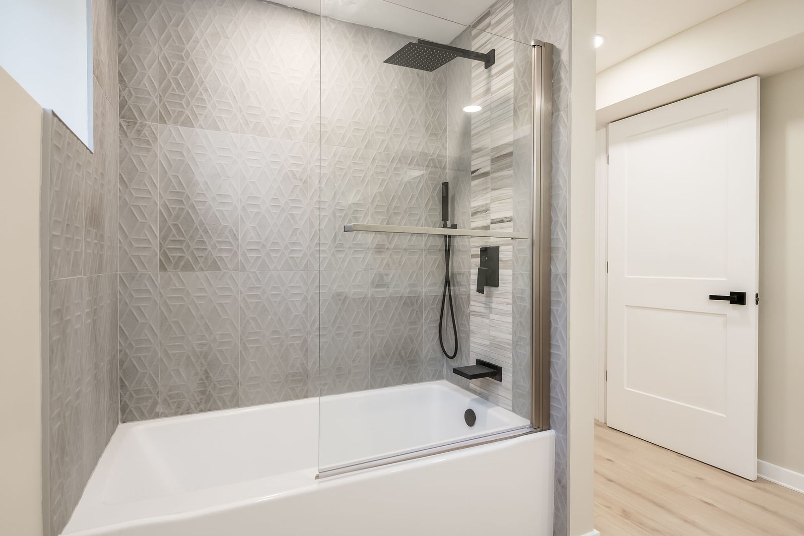 5144 North Kolmar Avenue Chicago, IL 60630 - Photo 20 of 27 a bathroom with a bathtub and a shower