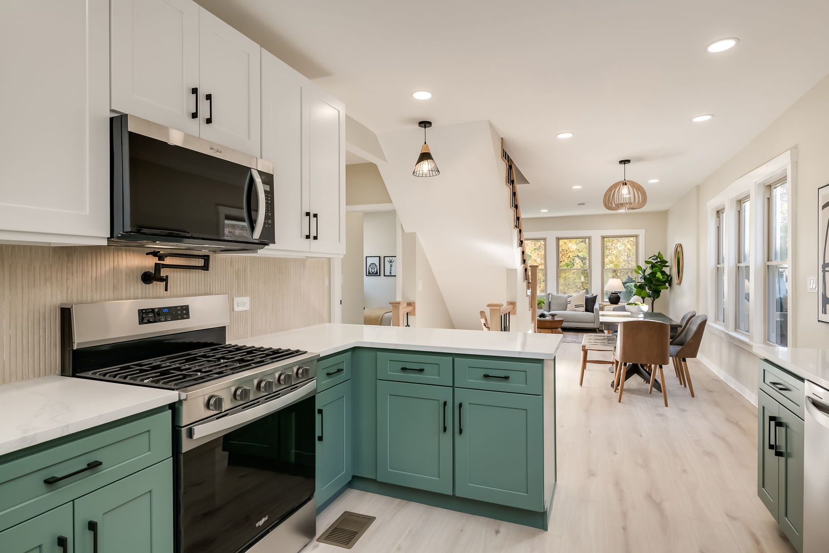 5144 North Kolmar Avenue Chicago, IL 60630 - Photo 9 of 27 a kitchen with a stove a sink and a microwave