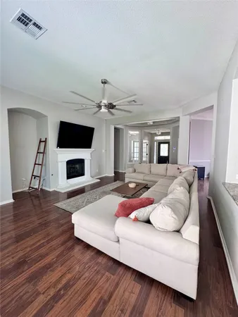 a living room with furniture and a fireplace