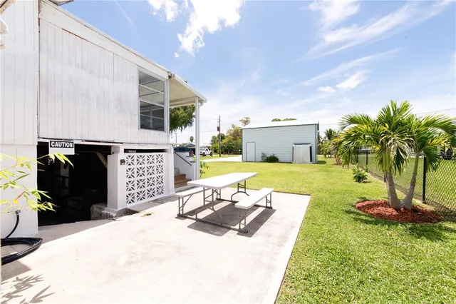 a view of a backyard with a patio