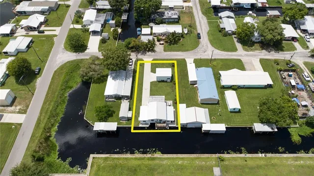 an aerial view of a house with a swimming pool