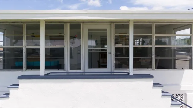 a view of a house with a large window and a large window
