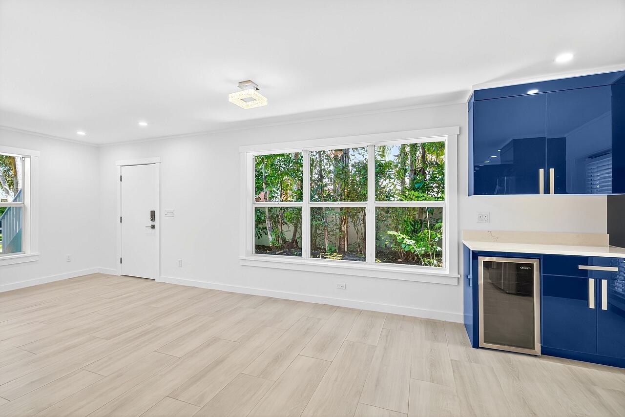 924 Coquina Lane, Unit 3 Vero Beach, FL 32963 - Photo 11 of 44 a view of an empty room with a fireplace and a window