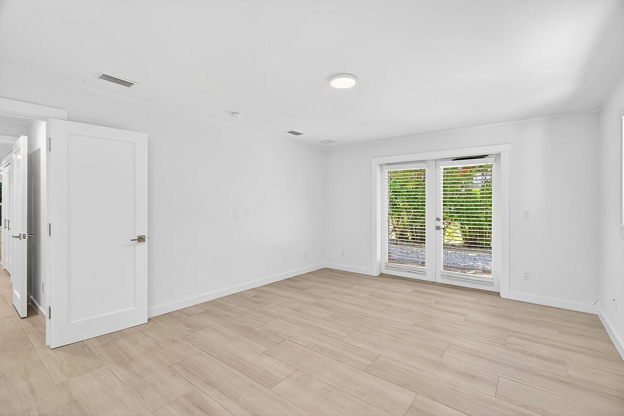 924 Coquina Lane, Unit 3 Vero Beach, FL 32963 - Photo 23 of 44 a view of an empty room with a window