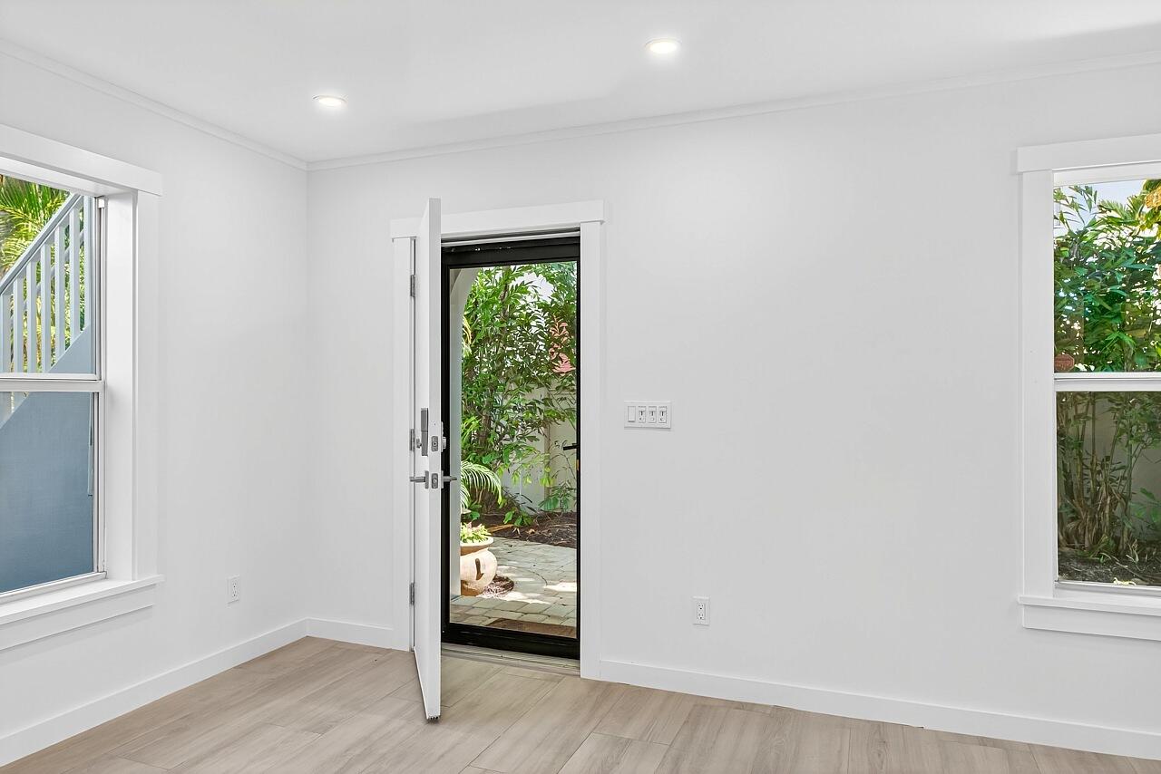 924 Coquina Lane, Unit 3 Vero Beach, FL 32963 - Photo 3 of 44 an empty room with windows and closet
