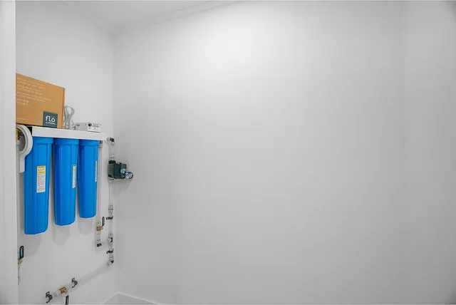 a bathroom with a shower and a sink