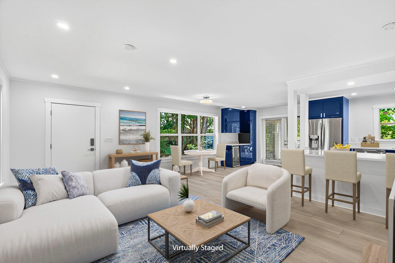 924 Coquina Lane, Unit 3 Vero Beach, FL 32963 - Photo 6 of 44 a living room with furniture and a large window