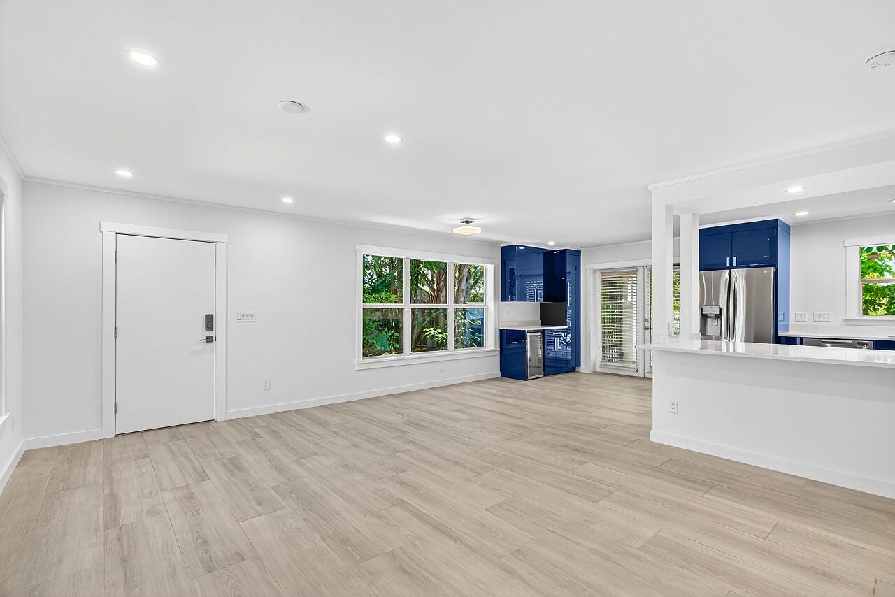 924 Coquina Lane, Unit 3 Vero Beach, FL 32963 - Photo 7 of 44 a view of an empty room with a window and kitchen view