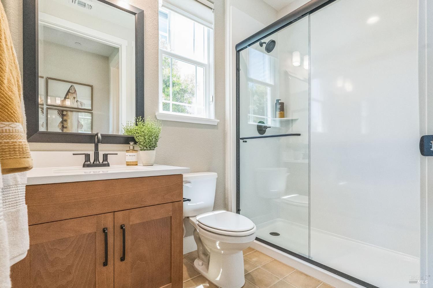 400 June Court Oakley, CA 94561 - Photo 24 of 33 a bathroom with a sink a toilet and shower