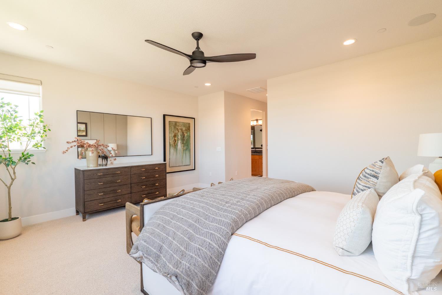 400 June Court Oakley, CA 94561 - Photo 30 of 33 a bedroom with a bed and a chandelier