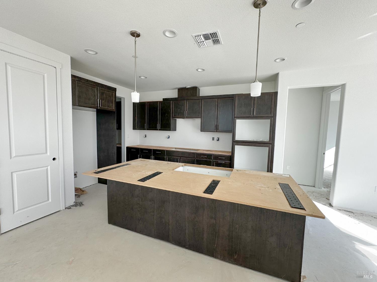 400 June Court Oakley, CA 94561 - Photo 33 of 34 a kitchen with kitchen island white cabinets and stainless steel appliances