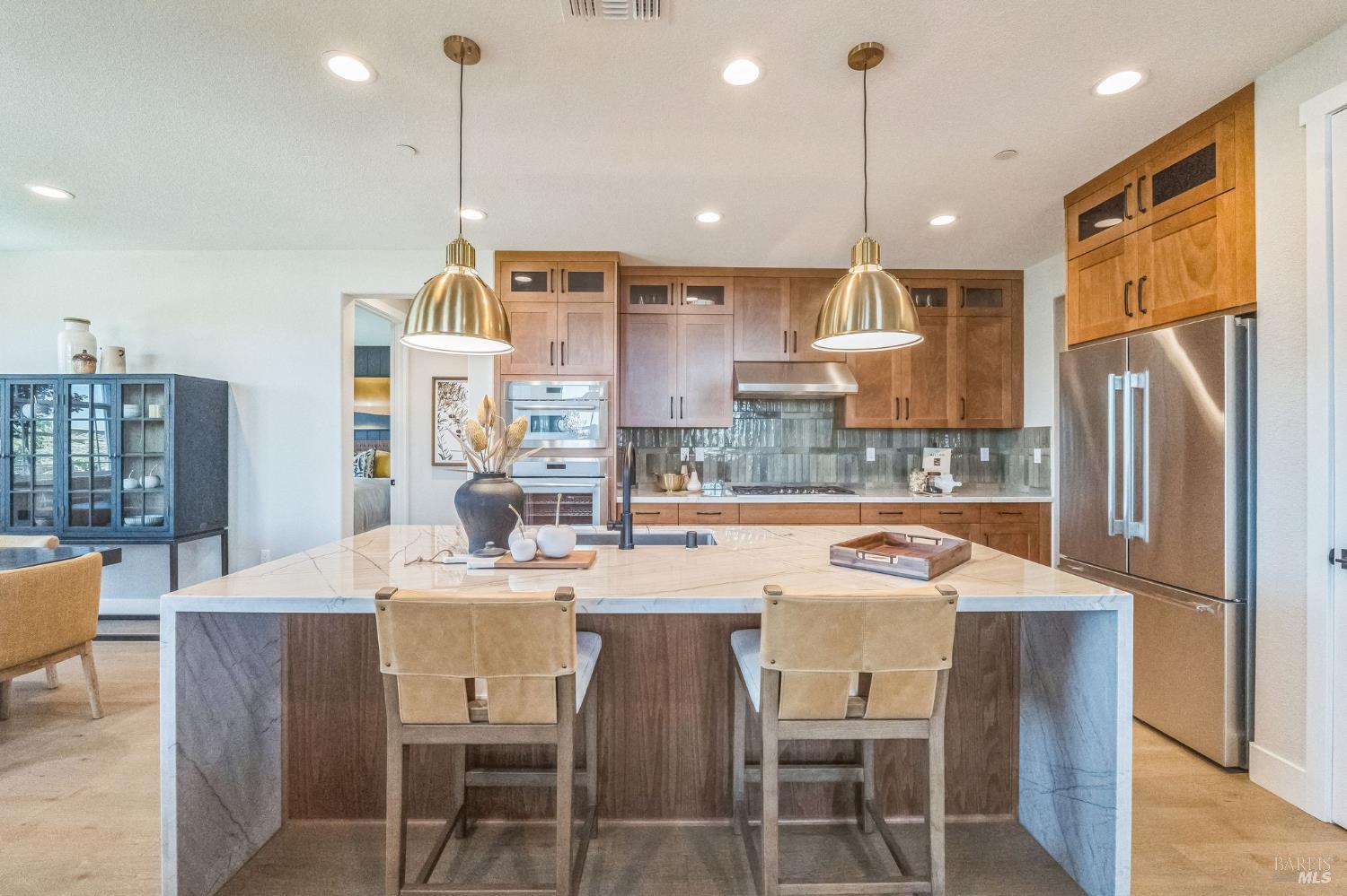 400 June Court Oakley, CA 94561 - Photo 7 of 33 a kitchen with stainless steel appliances a dining table chairs refrigerator and microwave