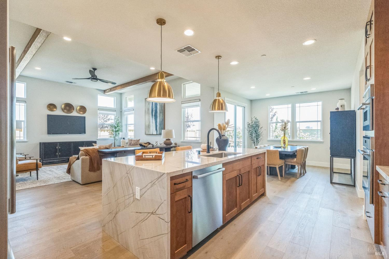400 June Court Oakley, CA 94561 - Photo 10 of 33 a large kitchen with kitchen island a large counter top space a sink a stove and a large window