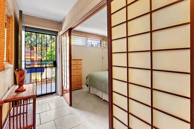 a bedroom with furniture and a window