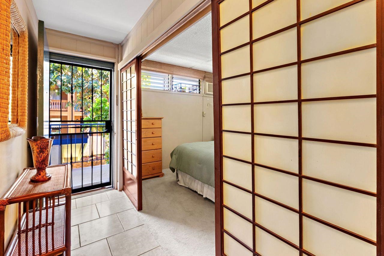 3750 Lower Honoapiilani Road, Unit 202 Lahaina, HI 96761 - Photo 11 of 22 a bedroom with furniture and a window