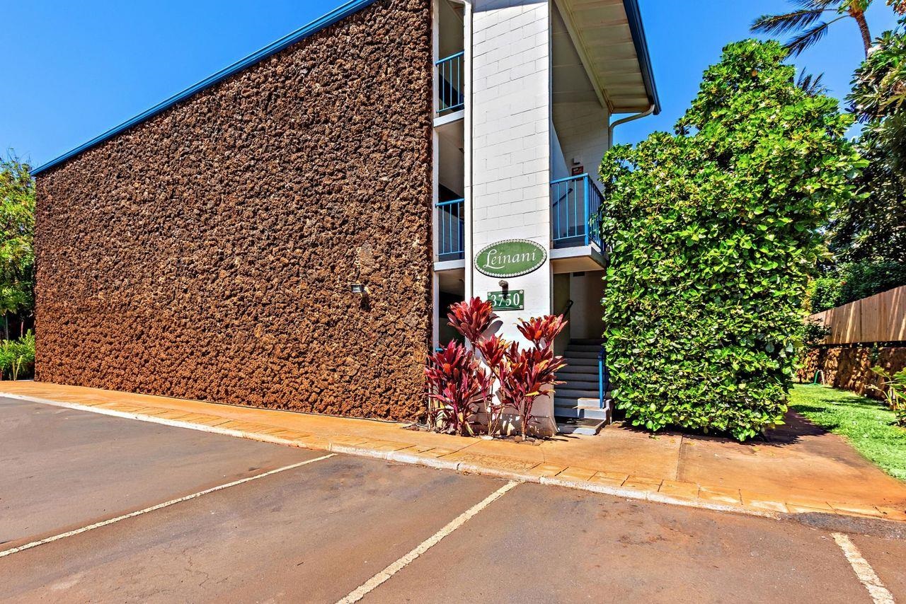 3750 Lower Honoapiilani Road, Unit 202 Lahaina, HI 96761 - Photo 18 of 22 a view of a brick wall with potted plants