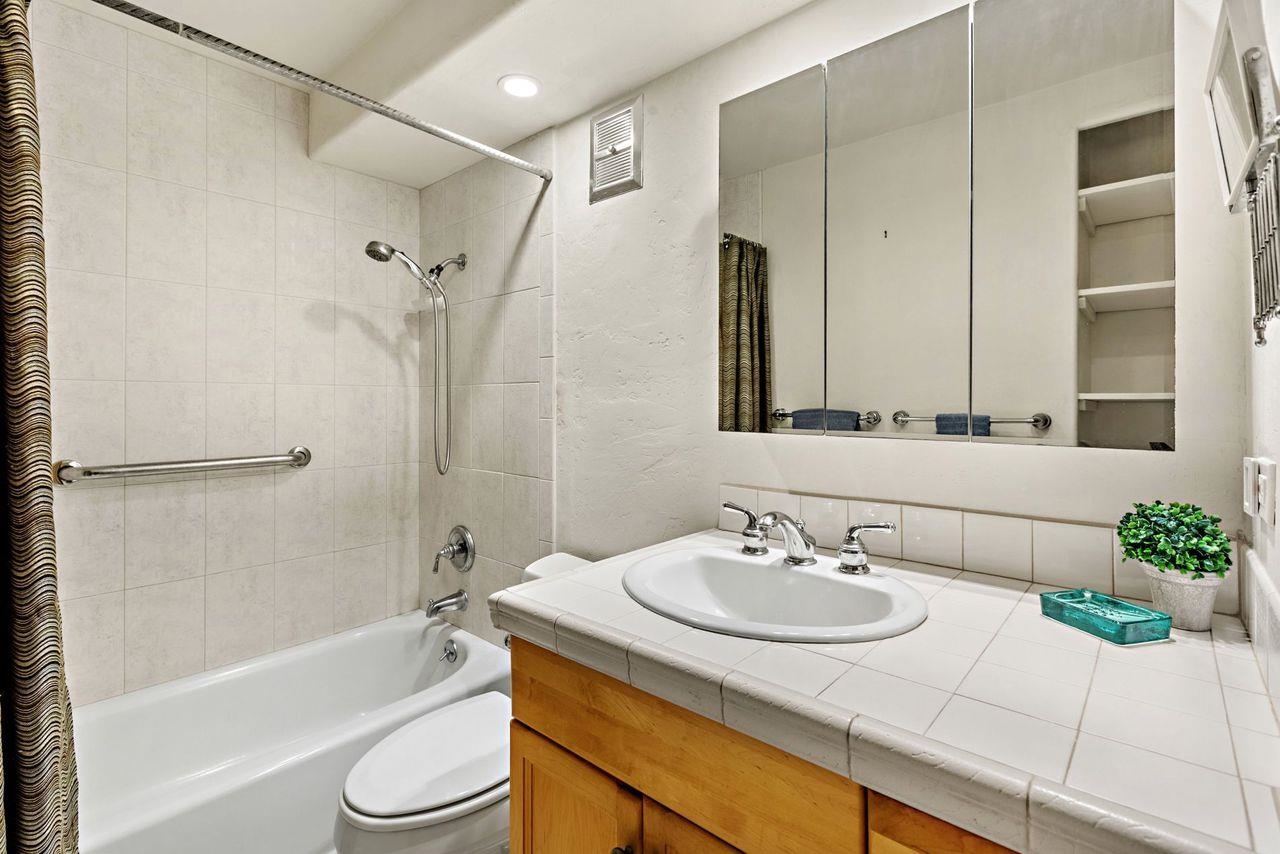 3750 Lower Honoapiilani Road, Unit 202 Lahaina, HI 96761 - Photo 10 of 22 a bathroom with a granite countertop sink a toilet and shower