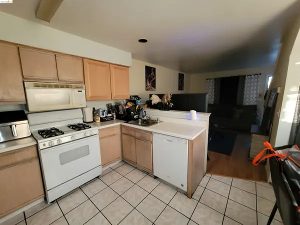 a kitchen with a sink cabinets and appliances
