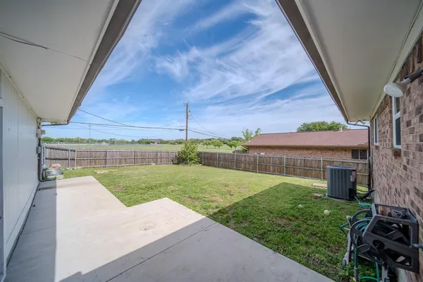 a view of a backyard with porch