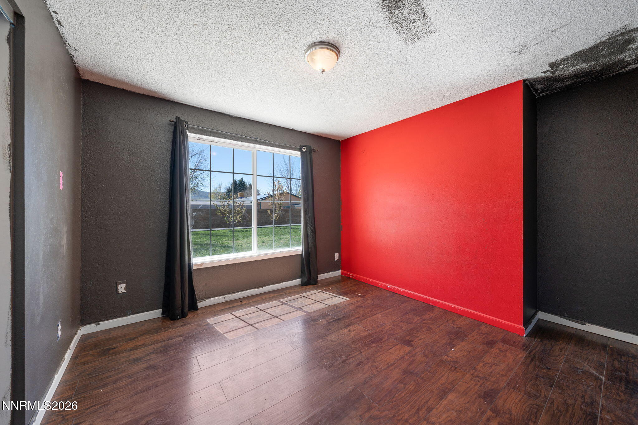 3590 Siskin Lane Reno, NV 89508 - Photo 13 of 31 an empty room with wooden floor and windows