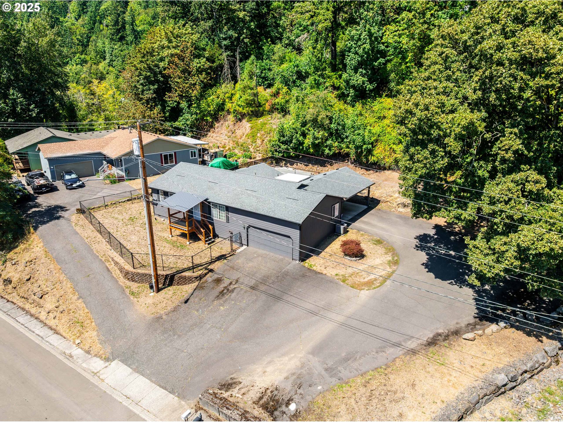 an aerial view of a house with swimming pool