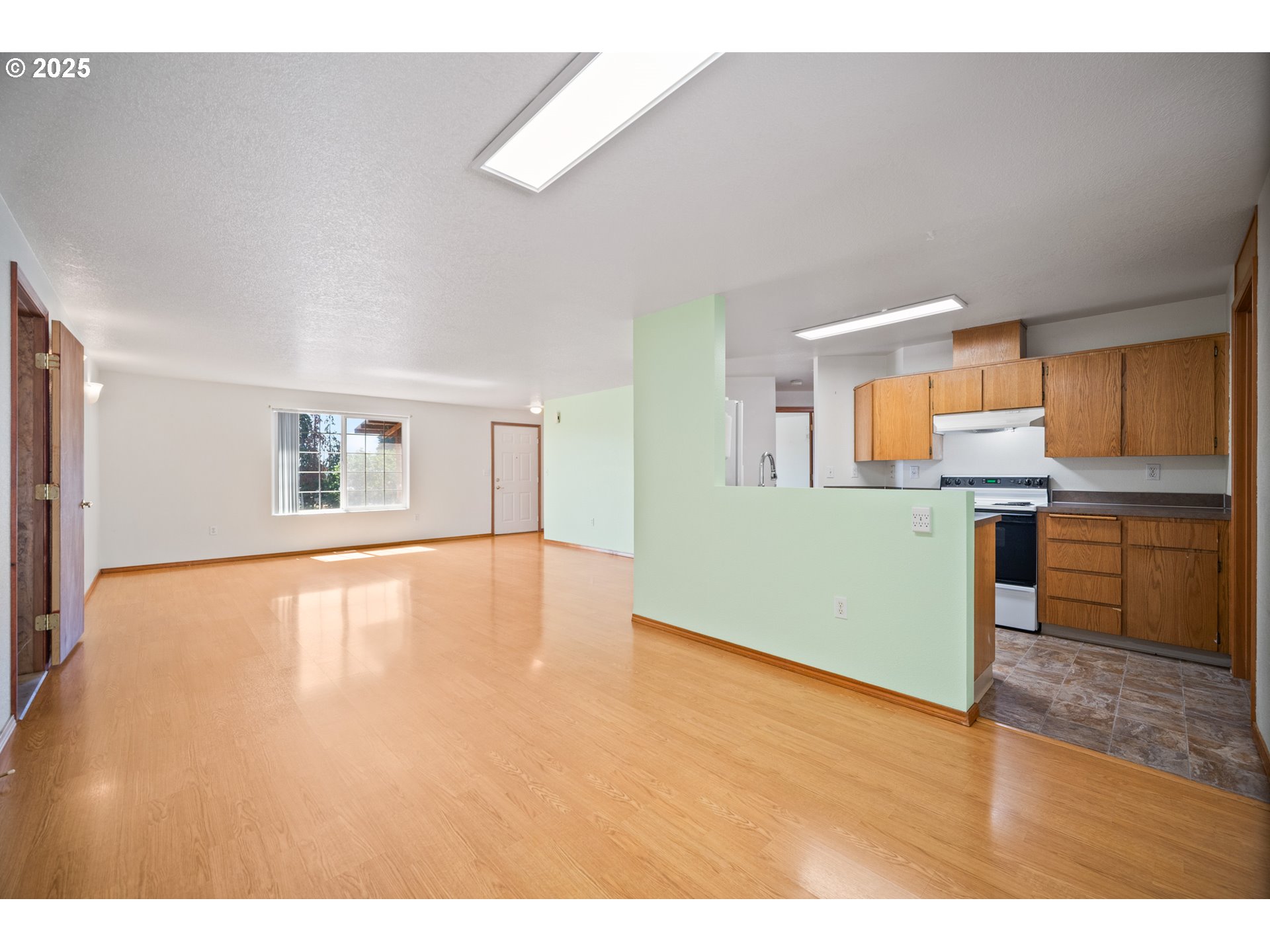2229 Northwest 6th Place Camas, WA 98607 - Photo 18 of 31 a view of a kitchen with a sink cabinets and a window