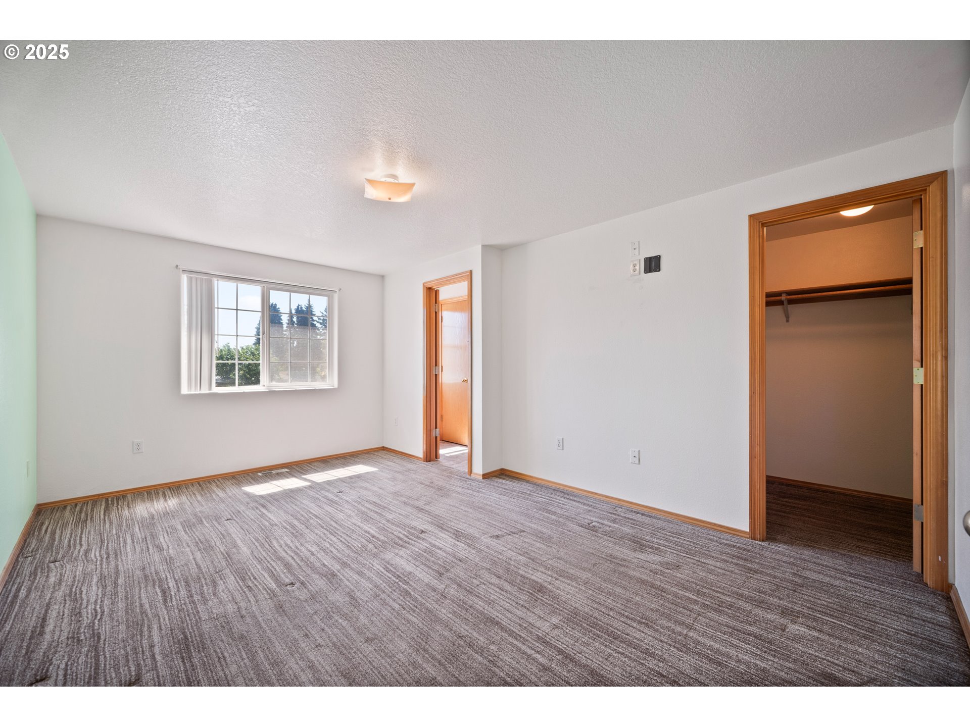 2229 Northwest 6th Place Camas, WA 98607 - Photo 6 of 31 a view of an empty room with wooden floor and a window