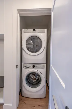 a view of a patio with couches and a fire pit and a yard