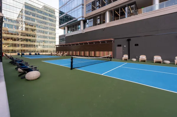 a swimming pool with outdoor seating and yard