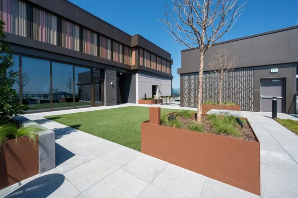 a living room with furniture and large windows