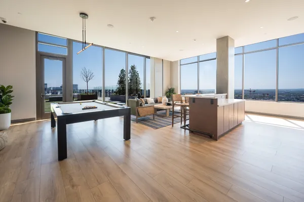 a dining room with furniture and wooden floor