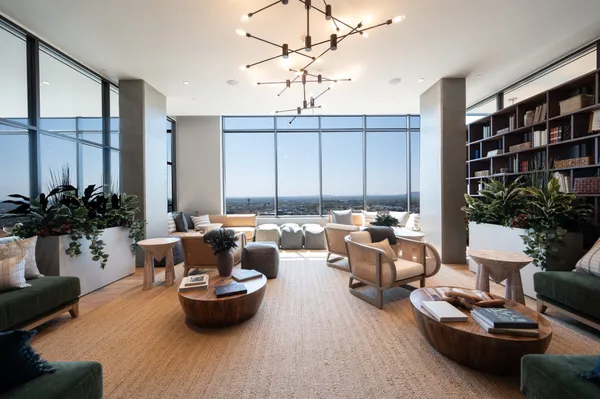 a living room with furniture and flowers