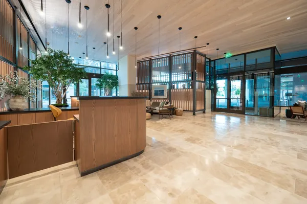 a view of a living room and kitchen