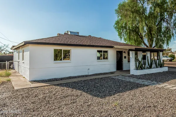 a house with trees in the background